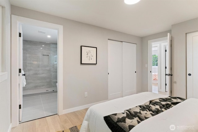 12804 NE 139th Ct, Kirkland, WA 98034 - bedroom featuring light wood-type flooring and ensuite bath