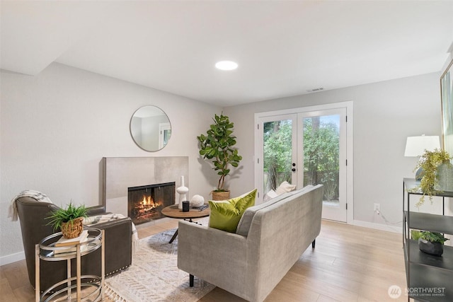 12804 NE 139th Ct, Kirkland, WA 98034 - living area featuring a premium fireplace, light wood-style floors, recessed lighting, and french doors