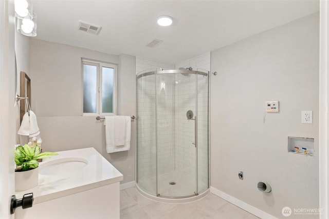 12804 NE 139th Ct, Kirkland, WA 98034 - bathroom featuring a stall shower, vanity, and tile patterned flooring