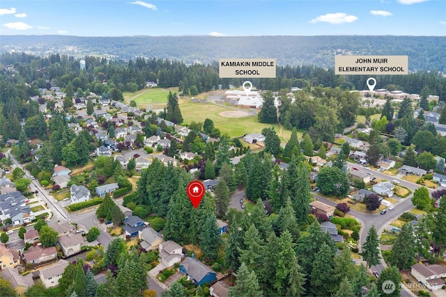 12804 NE 139th Ct, Kirkland, WA 98034 - aerial overview of property's location featuring nearby suburban area and a heavily wooded area