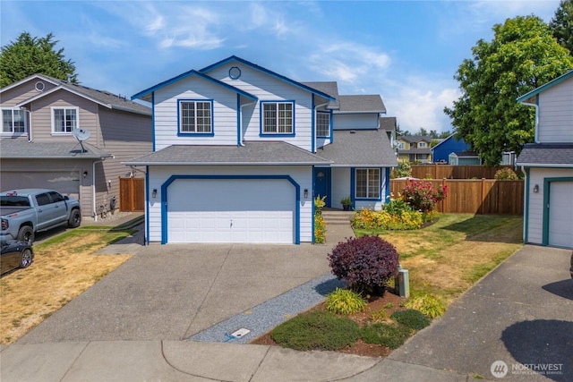 4517 35th St NE, Tacoma, WA 98422 - traditional home with asphalt driveway, an attached garage, and a shingled roof