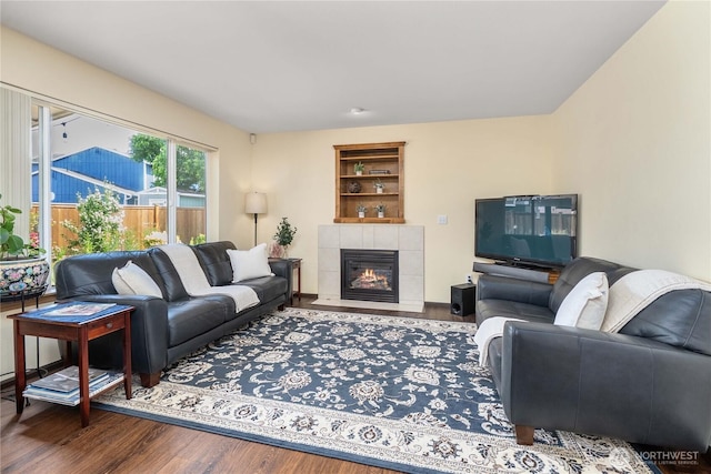 4517 35th St NE, Tacoma, WA 98422 - living room with wood finished floors, built in shelves, and a tiled fireplace