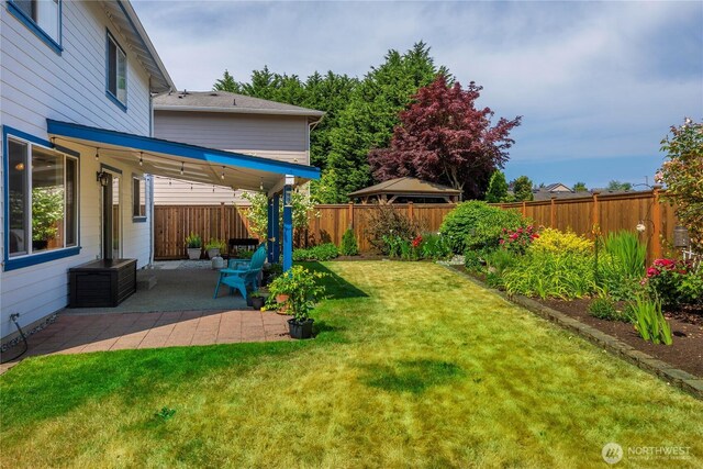 4517 35th St NE, Tacoma, WA 98422 - fenced backyard with a patio area