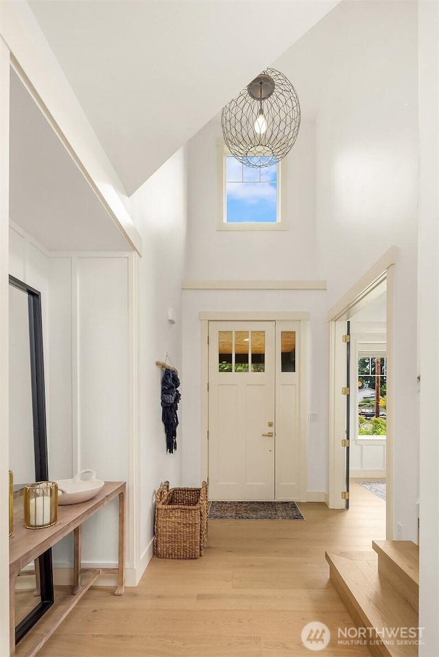 8411 202nd St SW, Edmonds, WA 98026 - foyer featuring light wood-style floors and a towering ceiling