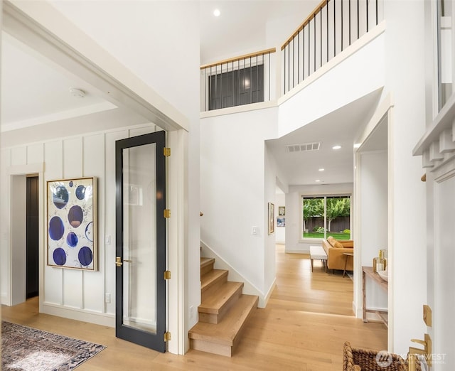 8411 202nd St SW, Edmonds, WA 98026 - foyer entrance with stairway, light wood-style floors, and a high ceiling