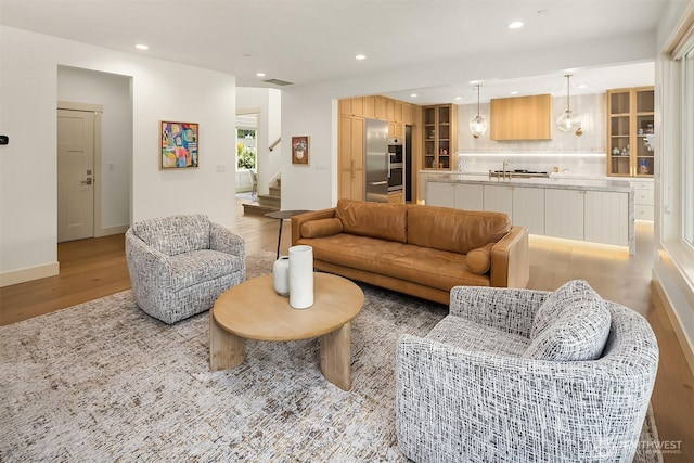 8411 202nd St SW, Edmonds, WA 98026 - living area featuring light wood-style floors, recessed lighting, and stairway