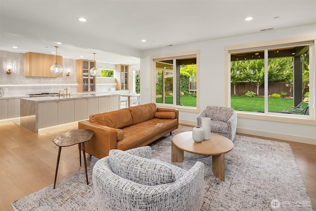 8411 202nd St SW, Edmonds, WA 98026 - living room featuring light wood-style flooring and recessed lighting