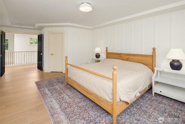 8411 202nd St SW, Edmonds, WA 98026 - bedroom with wood finished floors and a decorative wall