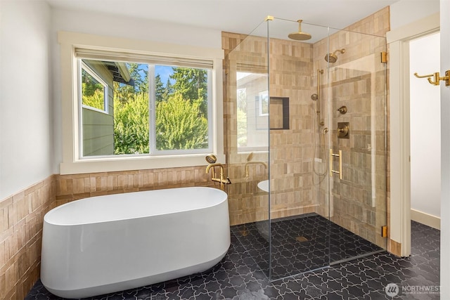 8411 202nd St SW, Edmonds, WA 98026 - bathroom with tile walls, a shower stall, a freestanding tub, and wainscoting