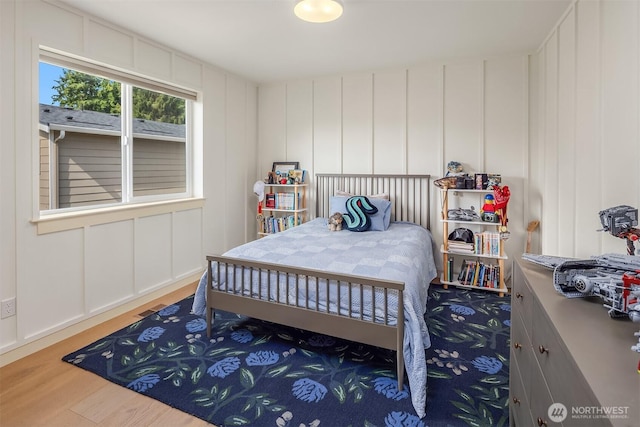 8411 202nd St SW, Edmonds, WA 98026 - bedroom featuring a decorative wall and wood finished floors