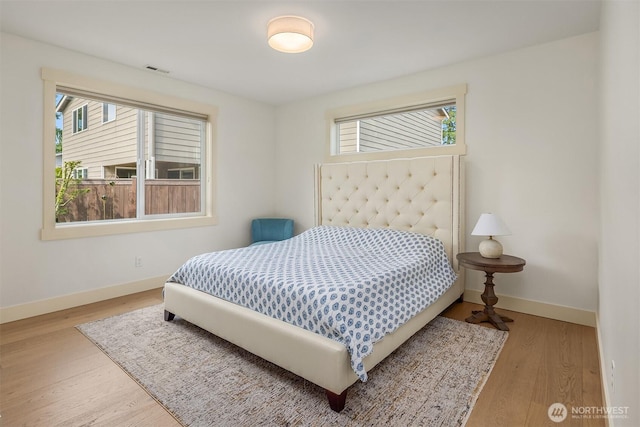 8411 202nd St SW, Edmonds, WA 98026 - bedroom with multiple windows and wood finished floors