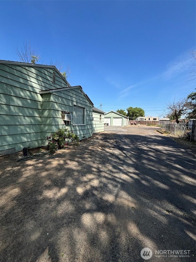 345 W Ridge Rd, Moses Lake, WA 98837 - view of home's exterior featuring a garage and an outbuilding