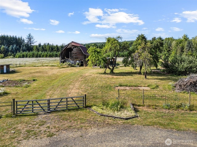 3381 Centralia Alpha Rd, Onalaska, WA 98570 - view of yard with a barn, an outdoor structure, and a rural view