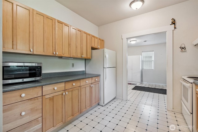 3381 Centralia Alpha Rd, Onalaska, WA 98570 - kitchen featuring white appliances, dark countertops, and light brown cabinetry