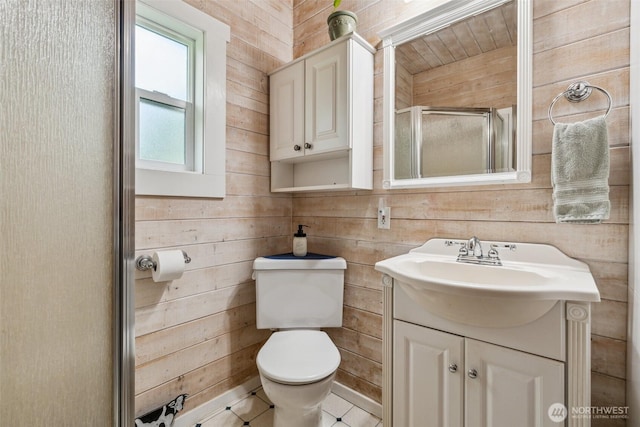 3381 Centralia Alpha Rd, Onalaska, WA 98570 - bathroom featuring a shower stall, vanity, tile patterned floors, and wooden walls
