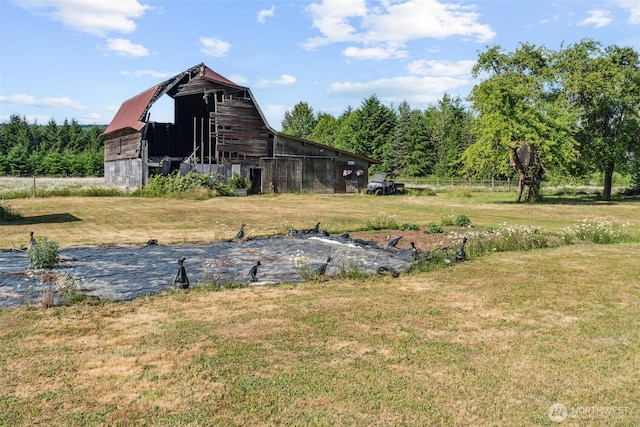 3381 Centralia Alpha Rd, Onalaska, WA 98570 - view of grassy yard featuring a barn and an outbuilding