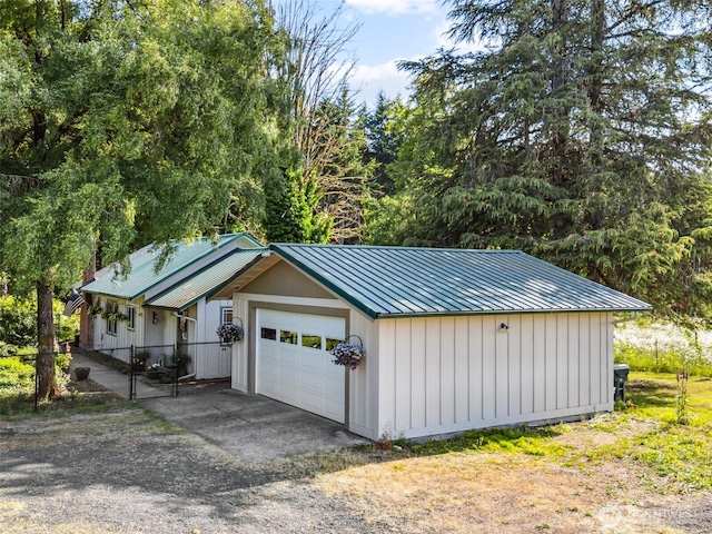 3381 Centralia Alpha Rd, Onalaska, WA 98570 - garage with dirt driveway and a gate