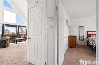 416 S Bel Air Loop SW, Ocean Shores, WA 98569 - bedroom featuring carpet floors and high vaulted ceiling