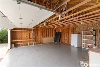416 S Bel Air Loop SW, Ocean Shores, WA 98569 - garage with freestanding refrigerator