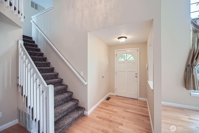 15831 Northup Way Unit 26, Bellevue, WA 98008 - entryway featuring light wood-style floors and stairway