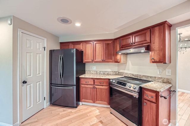 15831 Northup Way Unit 26, Bellevue, WA 98008 - kitchen with freestanding refrigerator, stainless steel electric range oven, under cabinet range hood, light wood-style flooring, and light stone countertops