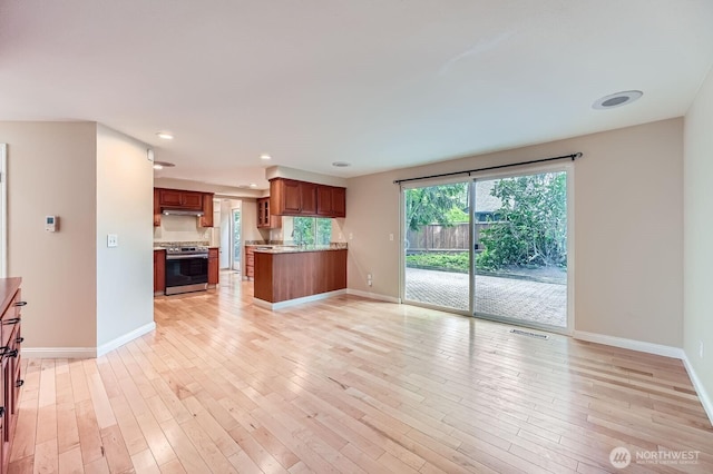 15831 Northup Way Unit 26, Bellevue, WA 98008 - unfurnished living room featuring light wood-style floors and recessed lighting