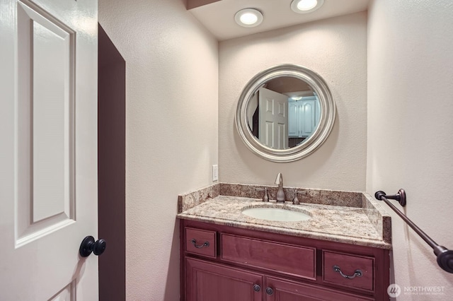 15831 Northup Way Unit 26, Bellevue, WA 98008 - bathroom featuring vanity and a textured wall
