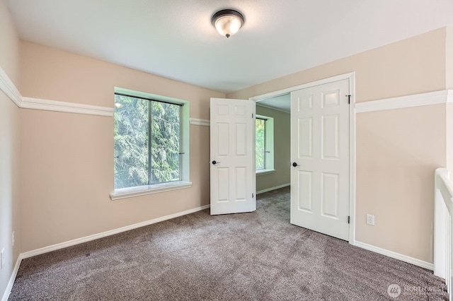 15831 Northup Way Unit 26, Bellevue, WA 98008 - unfurnished bedroom with carpet flooring and baseboards