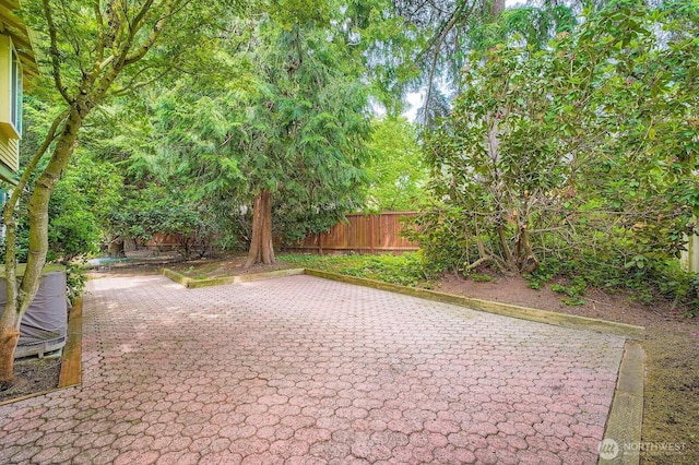 15831 Northup Way Unit 26, Bellevue, WA 98008 - fenced backyard with a patio area