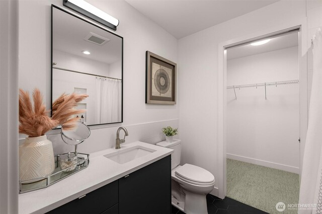 222B 10th Ave E, Seattle, WA 98102 - full bathroom with vanity, a walk in closet, and tile patterned flooring