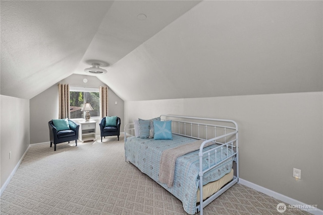 378 Eridani Loop SE, Ocean Shores, WA 98569 - bedroom featuring vaulted ceiling and carpet flooring