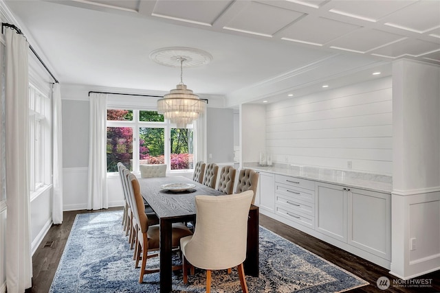 6581 156th Ave SE, Bellevue, WA 98006 - dining space with dark wood-type flooring, a chandelier, a wainscoted wall, and crown molding
