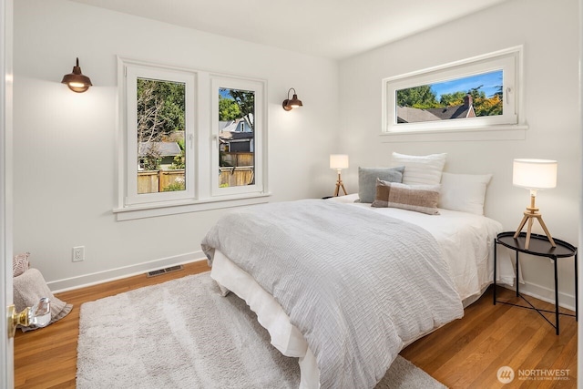 3112 NE 65th St, Seattle, WA 98115 - bedroom with multiple windows and wood finished floors
