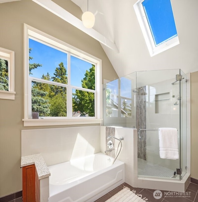 3112 NE 65th St, Seattle, WA 98115 - bathroom featuring a skylight, a stall shower, plenty of natural light, and a bath