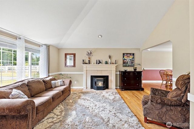 9321 339th St S Unit 5, Roy, WA 98580 - living room with lofted ceiling, wood finished floors, and a fireplace