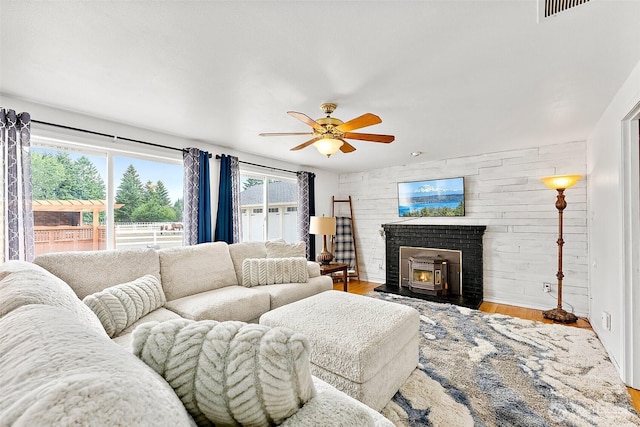 9321 339th St S Unit 5, Roy, WA 98580 - living area featuring a ceiling fan, wood finished floors, and a brick fireplace