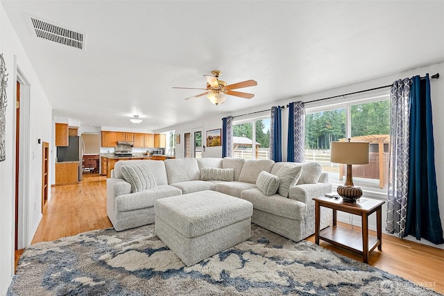 9321 339th St S Unit 5, Roy, WA 98580 - living area featuring light wood finished floors and ceiling fan