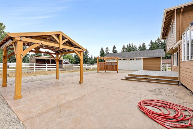 9321 339th St S Unit 5, Roy, WA 98580 - view of patio featuring an outdoor structure and a detached garage