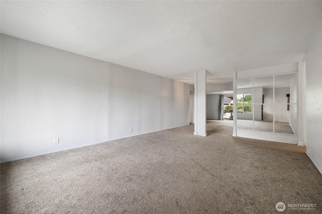 2220 91st St E, Tacoma, WA 98445 - carpeted empty room with a textured ceiling