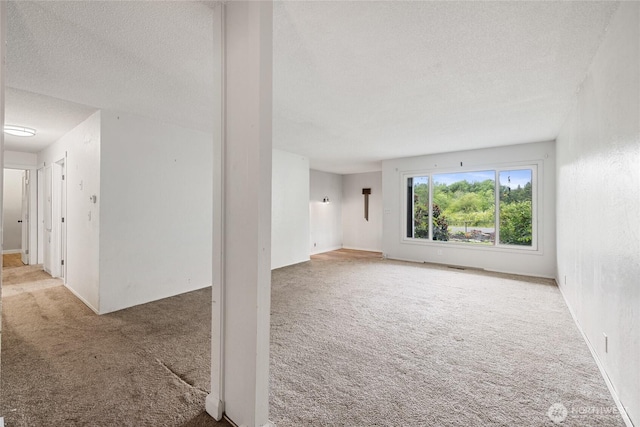 2220 91st St E, Tacoma, WA 98445 - spare room featuring carpet and a textured ceiling