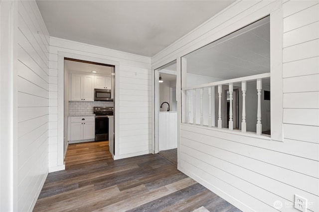 2220 91st St E, Tacoma, WA 98445 - hall featuring dark wood-type flooring and wood walls