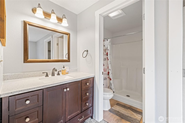 2220 91st St E, Tacoma, WA 98445 - full bath with vanity, a shower with shower curtain, and wood finished floors