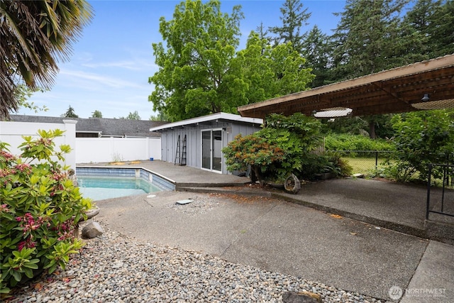 2220 91st St E, Tacoma, WA 98445 - view of pool featuring a fenced backyard, an outdoor structure, and a patio