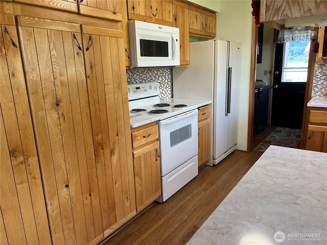 158 Skaggs Rd, Morton, WA 98356 - kitchen with white appliances, dark wood finished floors, light countertops, decorative backsplash, and brown cabinetry
