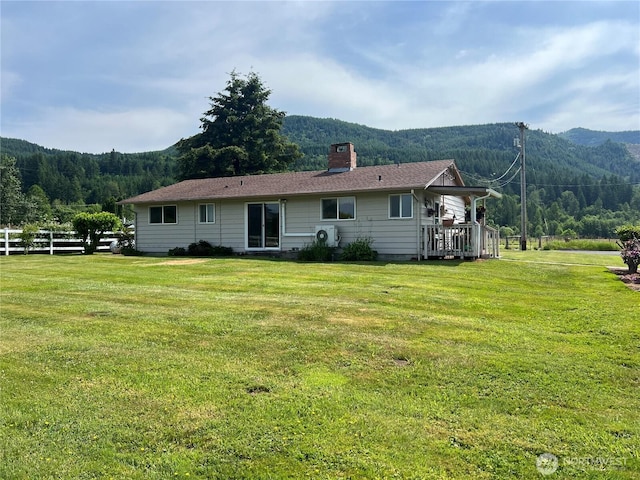 158 Skaggs Rd, Morton, WA 98356 - back of property with a chimney, a mountain view, and a wooded view