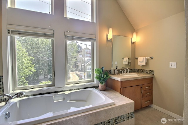 4411 Greenwood Ave N, Seattle, WA 98103 - full bath featuring a bath, vanity, tile patterned flooring, plenty of natural light, and vaulted ceiling
