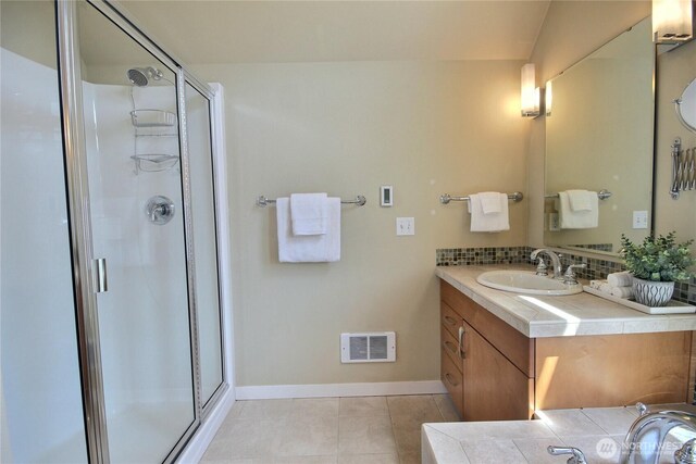 4411 Greenwood Ave N, Seattle, WA 98103 - full bathroom with vanity, a stall shower, and tile patterned floors