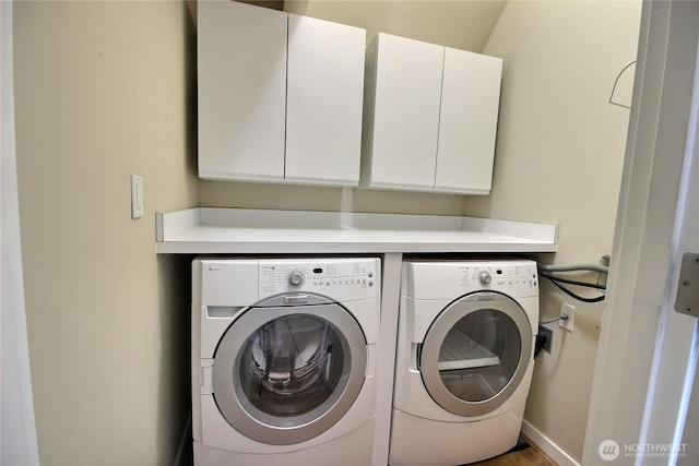 4411 Greenwood Ave N, Seattle, WA 98103 - laundry room with cabinet space and washer and dryer