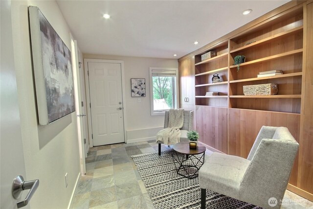 4411 Greenwood Ave N, Seattle, WA 98103 - sitting room with recessed lighting and light stone finish flooring