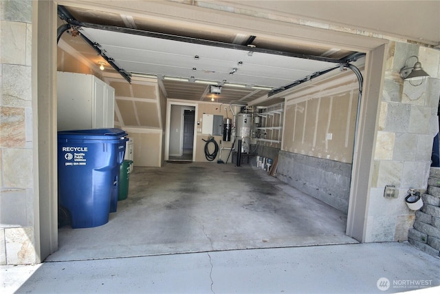 4411 Greenwood Ave N, Seattle, WA 98103 - garage featuring a garage door opener and secured water heater